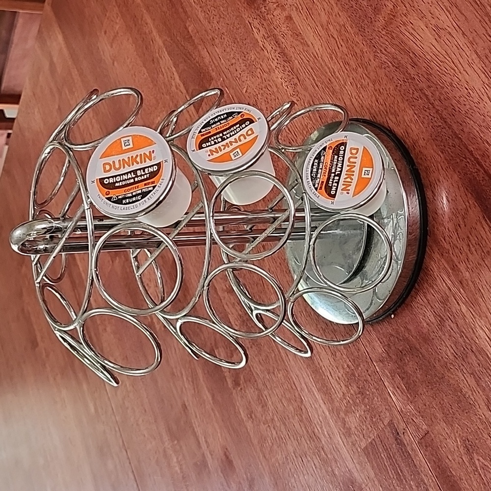 Rotating coffee pod holder